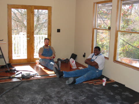 George and Ben lunching on the new hardwood floor in the Great Room